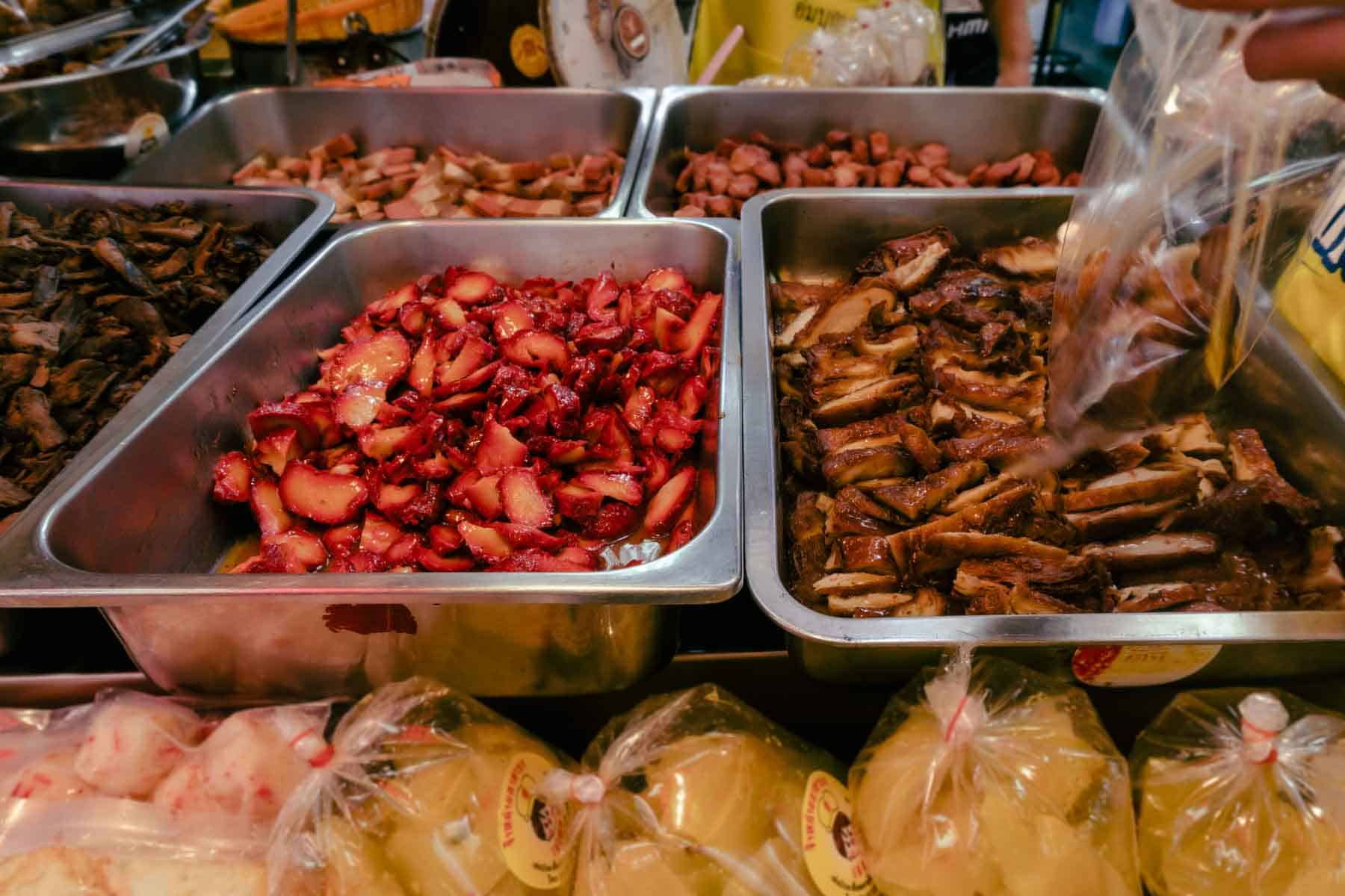 trays of red and brown vegan meats