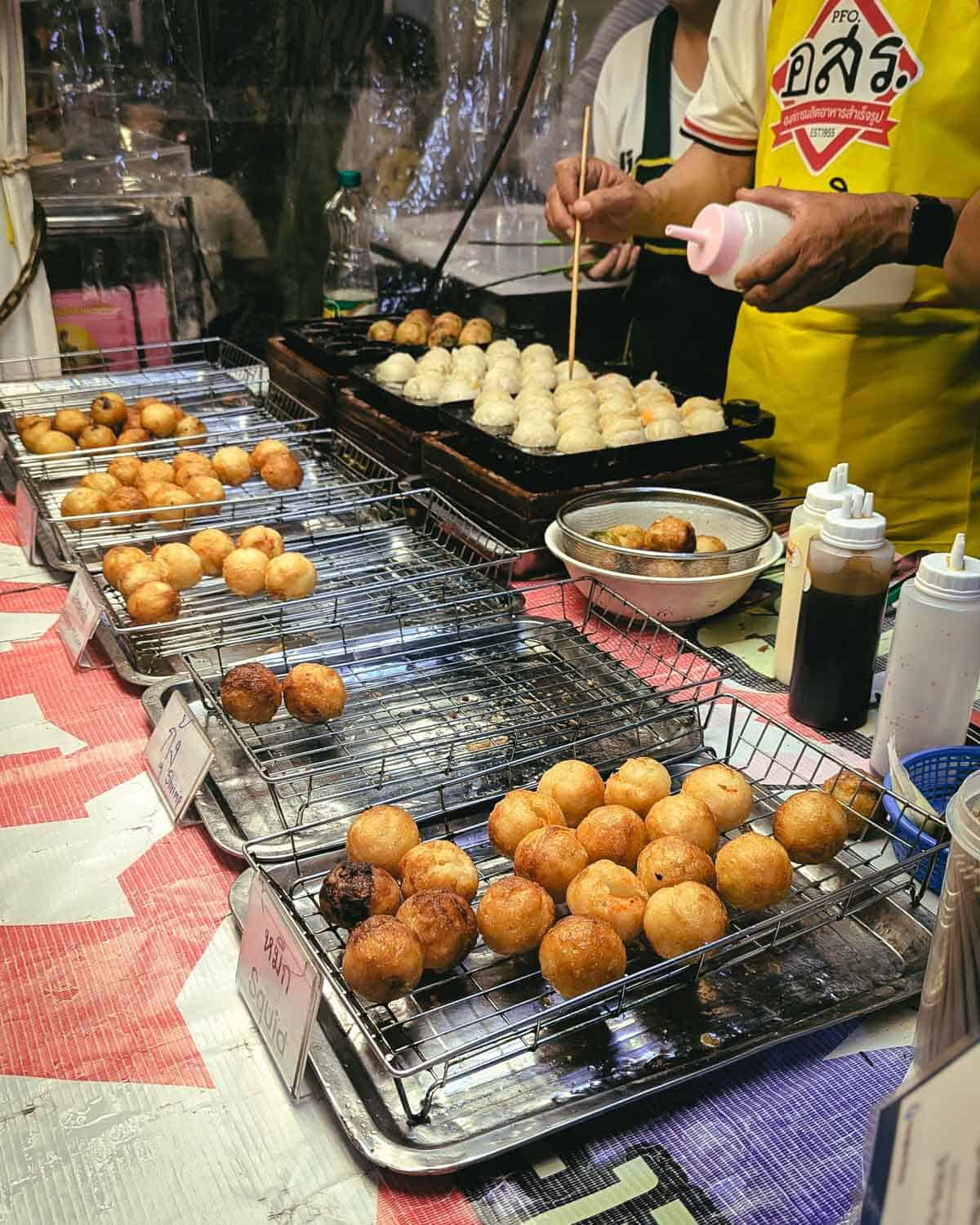 side view of a table of small globe shaped dumplings