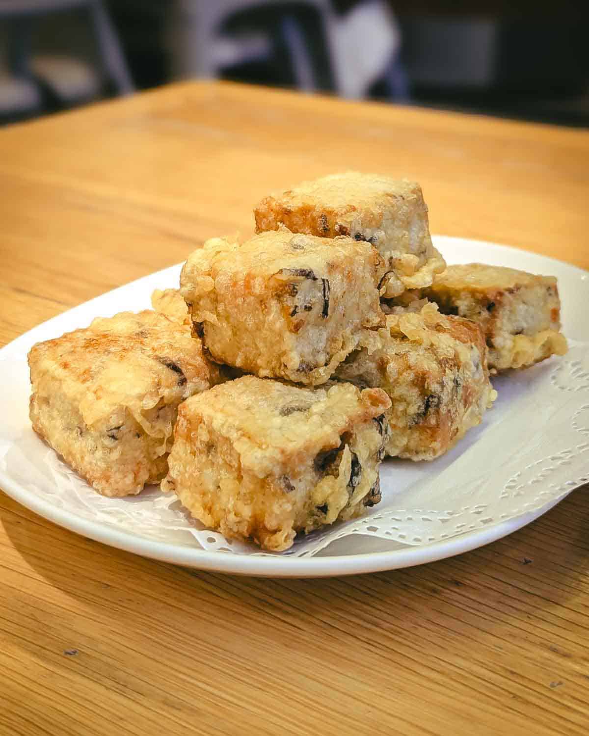 six cubes of crispy fried tofu