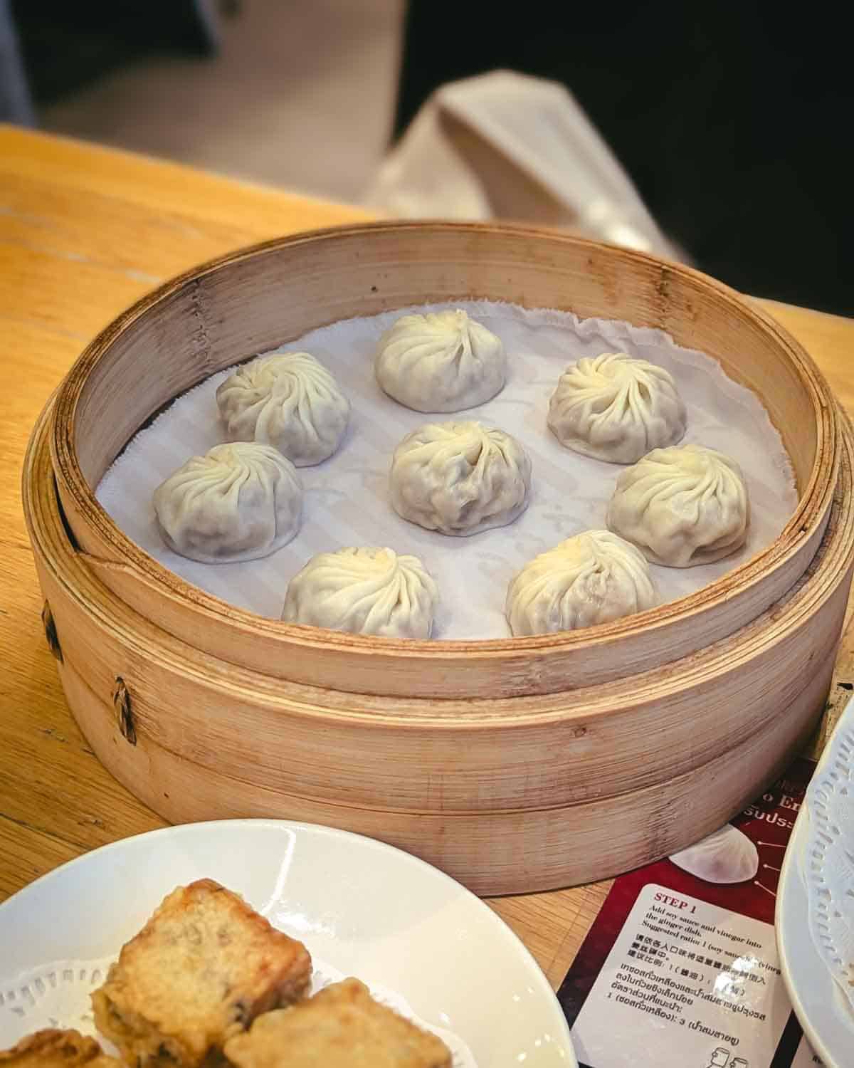 bamboo steamer with 8 dumplings