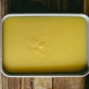 top down photo of a rectangular tray with yellow sweetcorn liang fen (starch jelly)